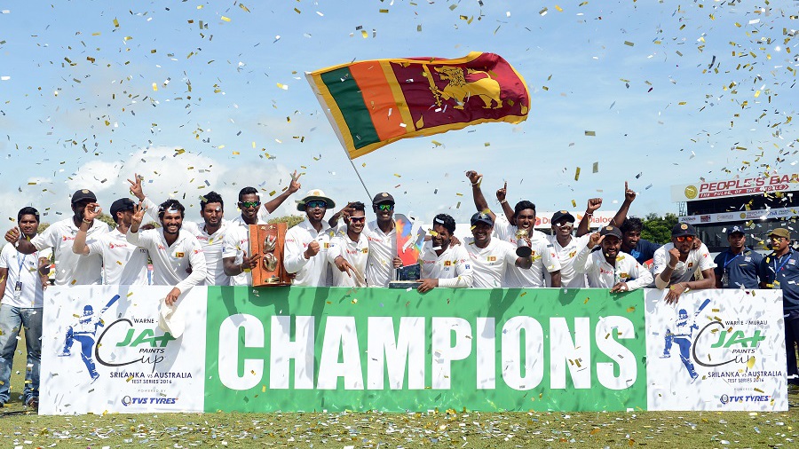 Sri Lanka's cricketers pose for photographers after victory in the third and final Test match between Sri Lanka and Australia at The Sinhalese Sports Club (SSC) Ground in Colombo on August 17, 2016. / AFP / LAKRUWAN WANNIARACHCHI        (Photo credit should read LAKRUWAN WANNIARACHCHI/AFP/Getty Images)