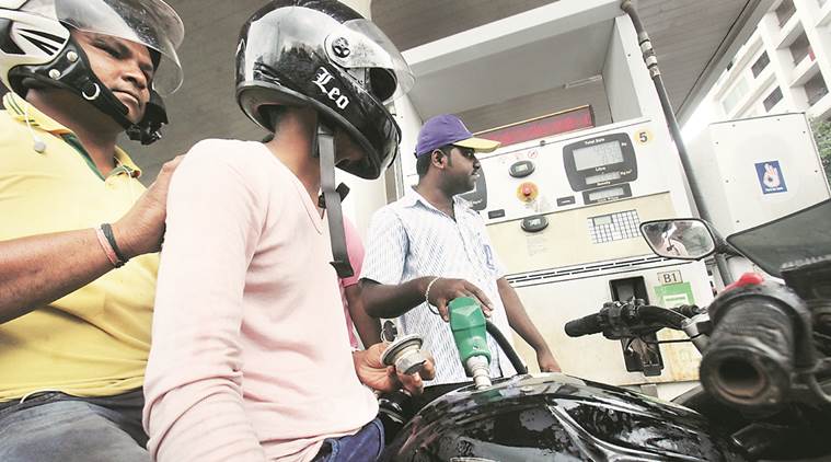 A view from the helmet of a protest against the 'No Helmet No Petrol' rule organised by Pune city congress committee by offering helmets to commuters to fill the petrol in petrol  pumps. Express Photo by Arul Horizon, 22-07-2016, Pune