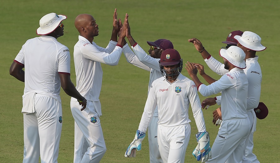 West Indies' cricketers celebrate after the dismissal of Pakistani cricket captain Misbah-ul-Haq unseen the third day of the third and final Test between Pakistan and the West Indies at the Sharjah Cricket Stadium in Sharjah on November 1, 2016. / AFP / AAMIR QURESHI        (Photo credit should read AAMIR QURESHI/AFP/Getty Images)