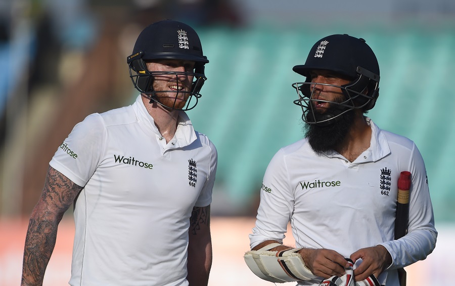 England's Ben Stokes (L) and Moeen Ali walk off the pitch at the end of play on the first day of the first Test cricket match between Indian and England at the Saurashtra Cricket Association stadium in Rajkot on November 9 2016. ----IMAGE RESTRICTED TO EDITORIAL USE - STRICTLY NO COMMERCIAL USE----- / AFP PHOTO / INDRANIL MUKHERJEE / ----IMAGE RESTRICTED TO EDITORIAL USE - STRICTLY NO COMMERCIAL USE----- / GETTYOUT