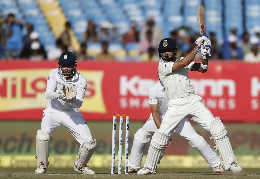 Indian cricket captain Virat Kohli bats on the fifth day of their first cricket test match between India and England in Rajkot, India, Sunday, Nov. 13, 2016. (AP Photo/Rafiq Maqbool)