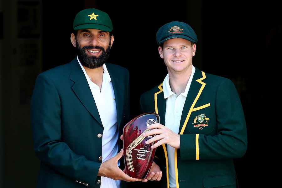 BRISBANE, AUSTRALIA - DECEMBER 14:  Misbah-ul-Haq of Pakistan and Steve Smith of Australia pose with the Commonwealth Bank series trophy during a media session at The Gabba on December 14, 2016 in Brisbane, Australia.  (Photo by Chris Hyde/Getty Images)