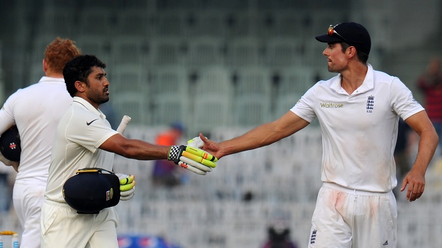 England's captain Alastair Cook (R) greets India's Karun Nair (L) after scoring triple-century (300 runs) during the fourth day of the fifth and final Test cricket match between India and England at the M.A. Chidambaram Stadium in Chennai on December 19, 2016. / AFP PHOTO / ARUN SANKAR / ----IMAGE RESTRICTED TO EDITORIAL USE - STRICTLY NO COMMERCIAL USE----- / GETTYOUT