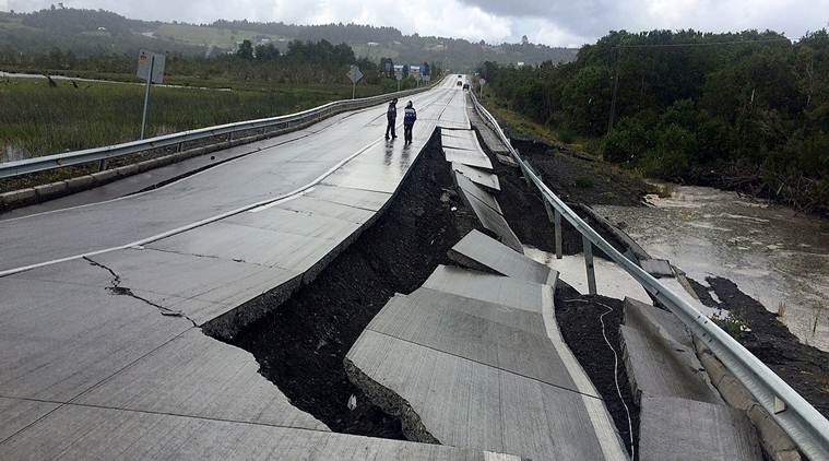 A damaged road is seen after a quake at Tarahuin, on Chiloe island, southern Chile, December 25, 2016. REUTERS/Alvaro Vidal EDITORIAL USE ONLY. NO RESALES. NO ARCHIVE     TPX IMAGES OF THE DAY