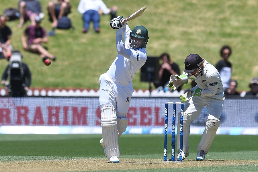 Bangladesh's Shakib Al Hasan (L) bats watched by New Zealand's keeper BJ Watling during day two of the first international Test cricket match between New Zealand and Bangladesh at the Basin Reserve in Wellington on January 13, 2017. / AFP / Marty Melville (Photo credit should read MARTY MELVILLE/AFP/Getty Images)