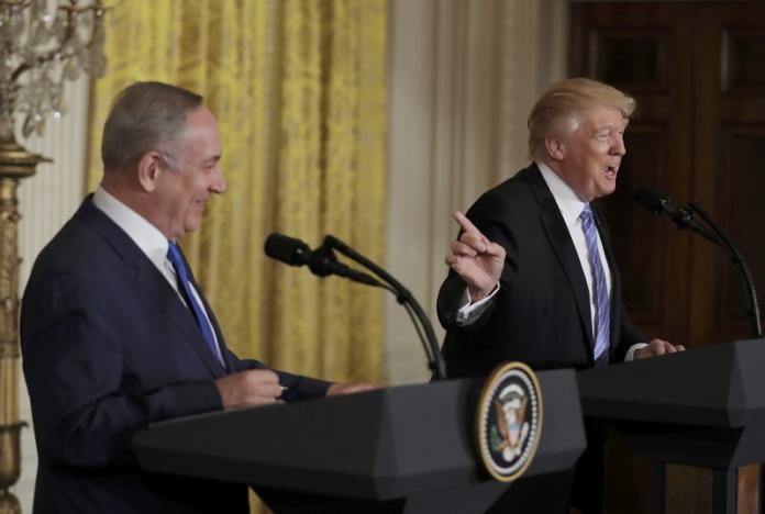 U.S. President Donald Trump (R) laughs with Israeli Prime Minister Benjamin Netanyahu at a joint news conference at the White House in Washington, U.S., February 15, 2017.    REUTERS/Kevin Lamarque