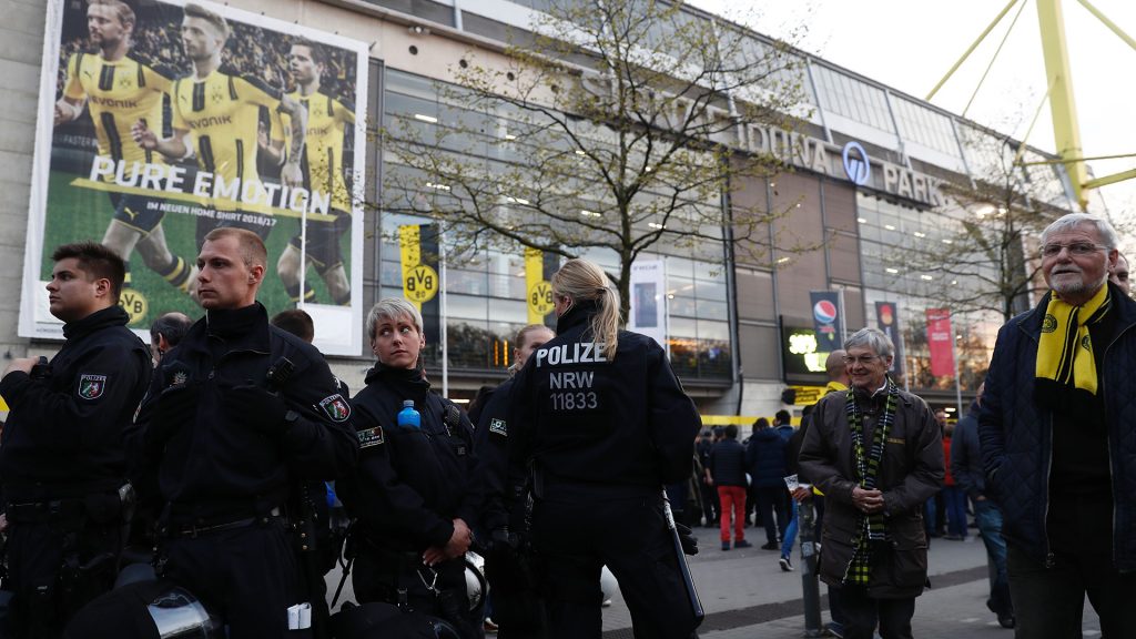 Police patrol outide the stadium after the team bus of Borussia Dortmund had some windows broken by an explosion some 10km away from the stadium prior to the UEFA Champions League 1st leg quarter-final football match BVB Borussia Dortmund v Monaco in Dortmund, western Germany on April 11, 2017. / AFP PHOTO / Odd ANDERSEN        (Photo credit should read ODD ANDERSEN/AFP/Getty Images)