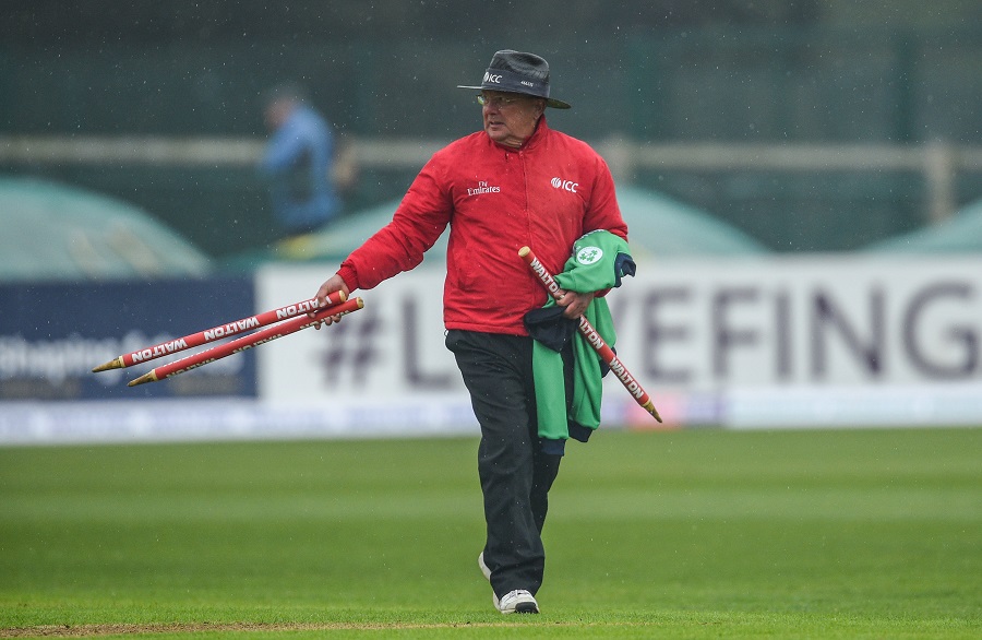 Dublin , Ireland - 12 May 2017; Umpire Ian Gould picks up the wickets after play is suspended due to rain during the International between Ireland and Bangladesh at Malahide in Co Dublin. (Photo By Cody Glenn/Sportsfile via Getty Images)