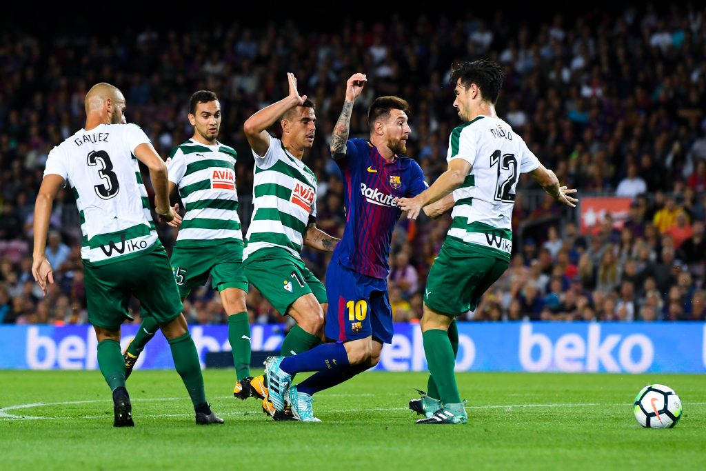 BARCELONA, SPAIN - SEPTEMBER 19:  Lionel Messi of FC Barcelona competes for the ball with four Eibar players during the La Liga match between Barcelona and SD Eibar at Camp Nou on September 19, 2017 in Barcelona, Spain.  (Photo by David Ramos/Getty Images)