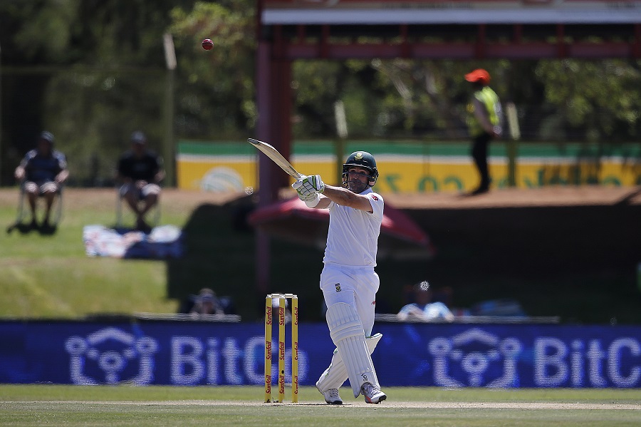 South African batsman Dean Elgar hits the ball during the first day of the second Test Match between South Africa and Bangladesh in Bloemfontein, on October 6, 2017. / AFP PHOTO / MARCO LONGARI