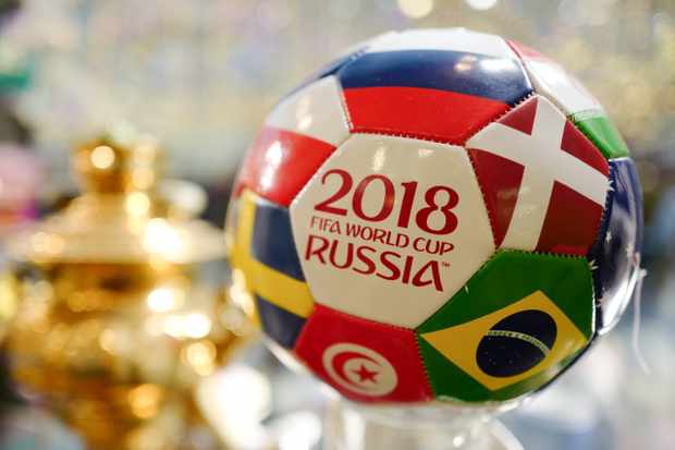 MOSCOW, RUSSIA - JUNE 12  A Russian tourism shop selling a 2018 FIFA World Cup Russia football with flags of the competing nations on it in Moscow ahead of the 2018 FIFA World Cup Russia on June 12, 2018 in Moscow, Russia. (Photo by Matthew Ashton - AMA/Getty Images)