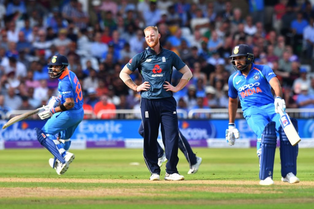 England's Ben Stokes (C) reacts as India's Rohit Sharma (L) and Virat Kohli (R) run between the wickets during the One Day International (ODI) cricket match between England and India at Trent Bridge in Nottingham central England on July 12, 2018. (Photo by Anthony Devlin / AFP) / RESTRICTED TO EDITORIAL USE. NO ASSOCIATION WITH DIRECT COMPETITOR OF SPONSOR, PARTNER, OR SUPPLIER OF THE ECB (Photo credit should read ANTHONY DEVLIN/AFP/Getty Images)