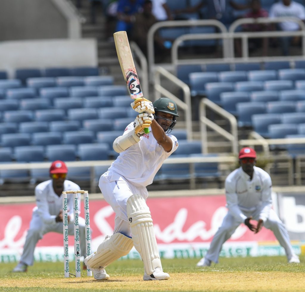Shakib Al Hasan (C) of Bangladesh hits 4 during day 2 of the 2nd Test between West Indies and Bangladesh at Sabina Park, Kingston, Jamaica, on July 13, 2018. / AFP PHOTO / Randy Brooks