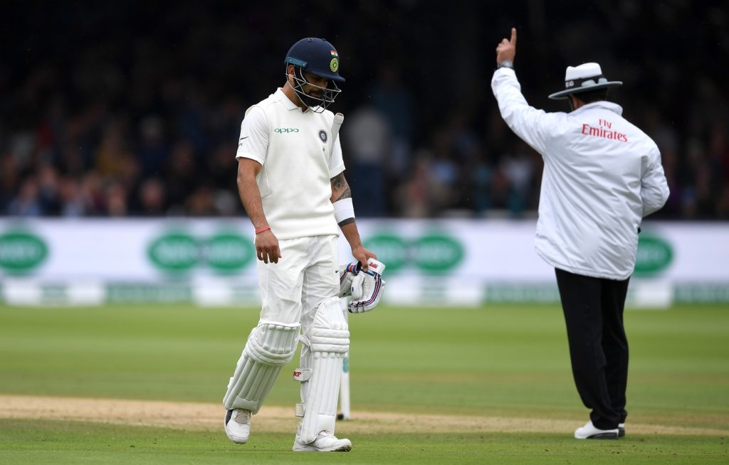 LONDON, ENGLAND - AUGUST 12:  India captain Virat Kohli leaves the field after being dismissed by Stuart Broad of England during day four of the 2nd Specsavers Test between England and India at Lord's Cricket Ground on August 12, 2018 in London, England.  (Photo by Gareth Copley/Getty Images)