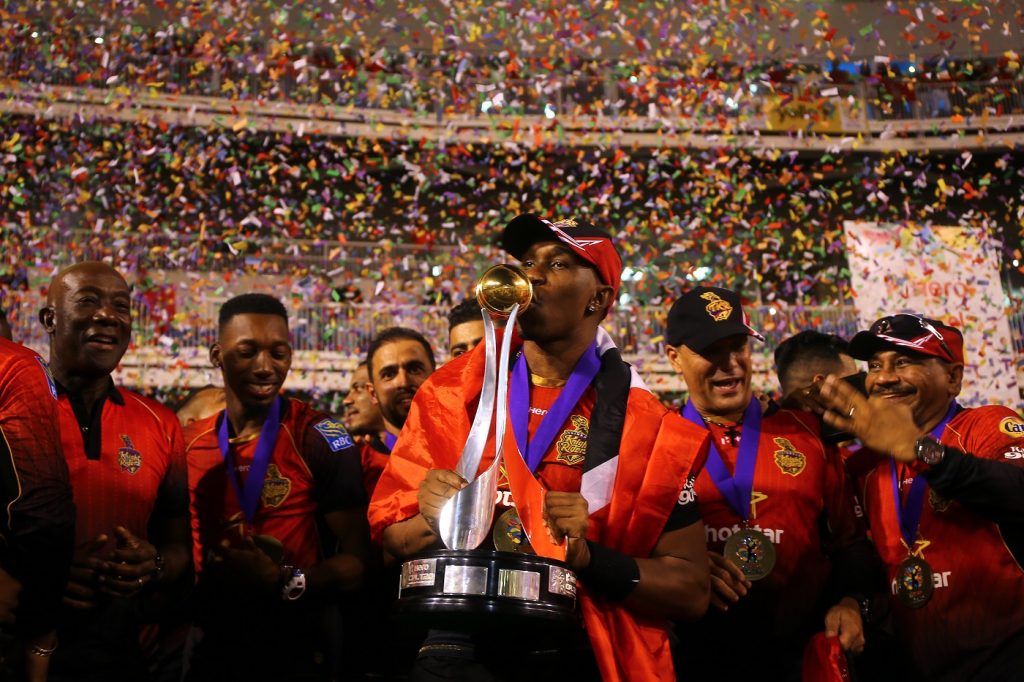 TAROUBA, TRINIDAD AND TOBAGO - SEPTEMBER 16: In this handout image provided by CPL T20, Dwayne Bravo captain of Trinbago Knight Riders kisses the trophy during the Hero Caribbean Premier League Final between Trinbago Knight Riders and Guyana Amazon Warriors at Brian Lara Stadium on September 16, 2018 in Tarouba, Trinidad and Tobago. (Photo by Ashley Allen - CPL T20/Getty Images)