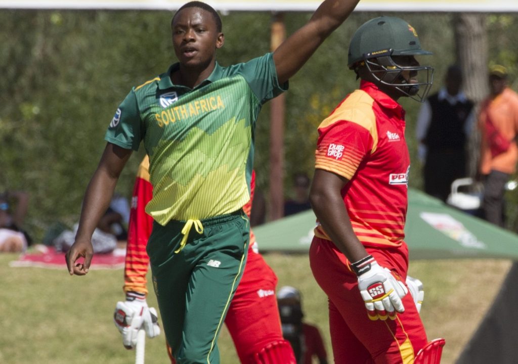 South Africa's bowler Kagiso Rabada (L) celebrates after dismissing Zimbabwe's Hamilton Masakadza (R) during the third One Day International cricket match between South Africa and Zimbabwe on October 6, 2018, at Boladnd Park, in Paarl, about 60 kilometres from Cape Town. / AFP PHOTO / RODGER BOSCH