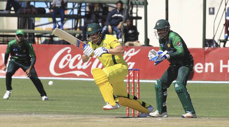 Australian batsman Aaron Finch, center, plays a shot during the T20 cricket match against Pakistan at Harare Sports Club, Monday, July, 2, 2018.Zimbabwe is playing host to a tri nation series between Australia and Pakistan with all matches played as Twenty20 Internationals(AP Photo/Tsvangirayi Mukwazhi)