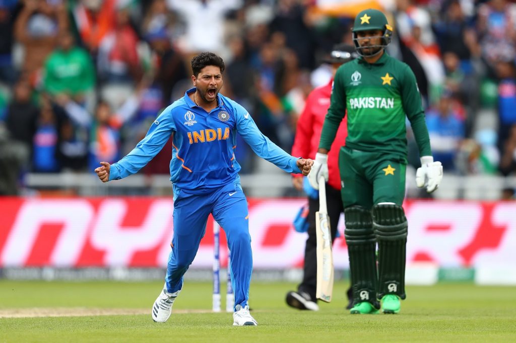 MANCHESTER, ENGLAND - JUNE 16: Kuldeep Yadav of India celebrates bowling Babar Azam of Pakistan during the Group Stage match of the ICC Cricket World Cup 2019 between India and Pakistan at Old Trafford on June 16, 2019 in Manchester, England.  (Photo by Michael Steele/Getty Images)