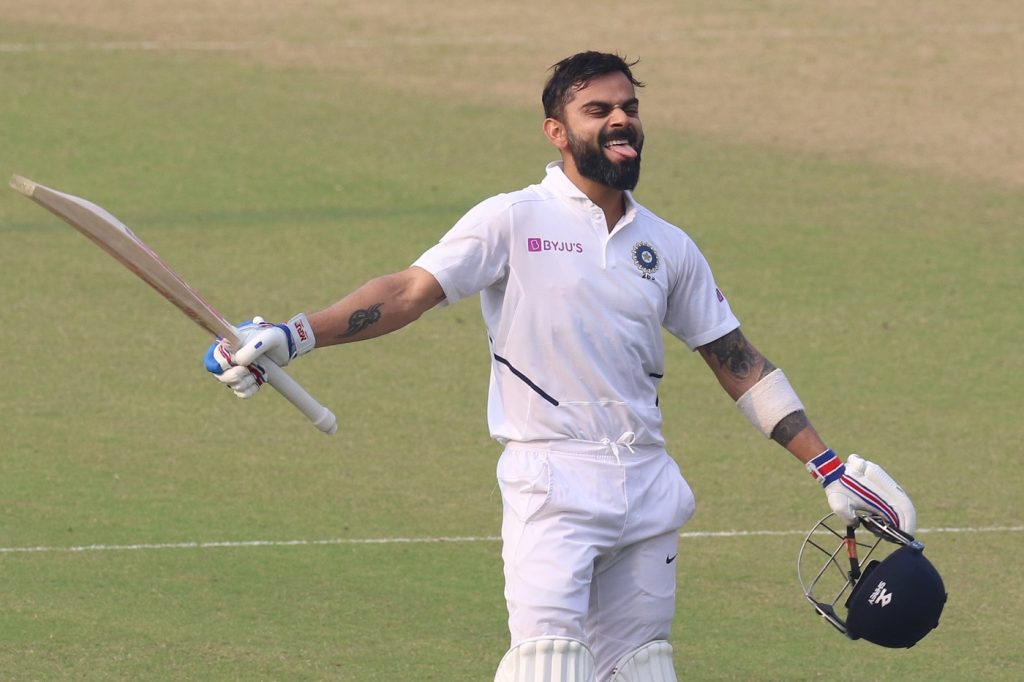 Virat Kohli (captain) of India celebrates his Hundred runs during day 2 of the 2nd Test match between India and Bangladesh held at the Eden Gardens Stadium, Kolkata on the 23rd November 2019.   (This test match is the first Day / Night Test match that India have taken part in) Photo by Deepak Malik / Sportzpics for BCCI