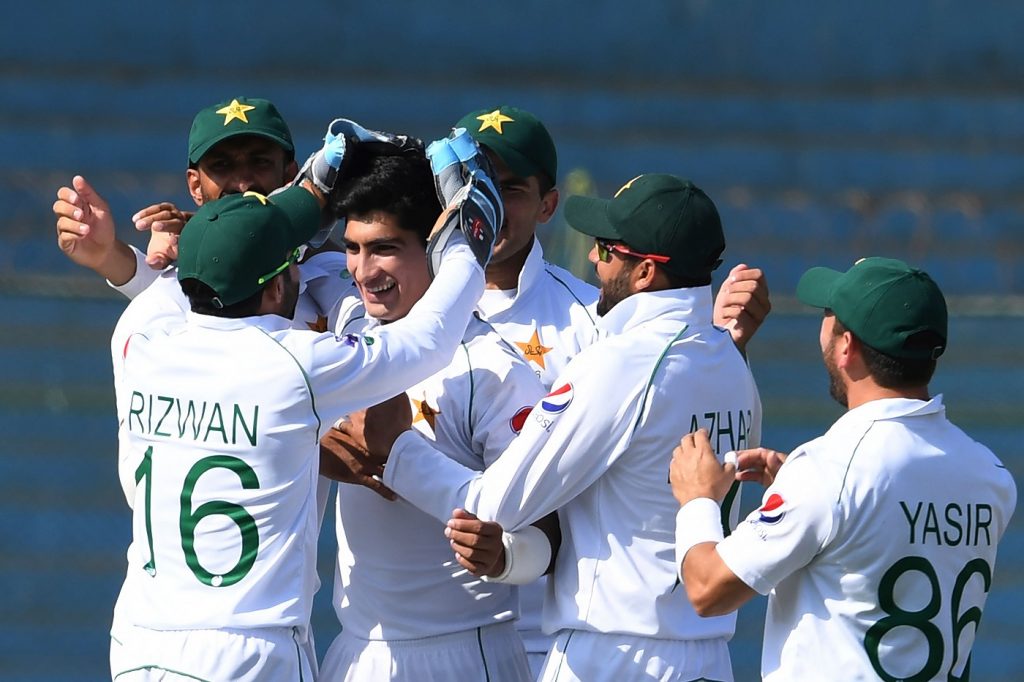 Pakistan's cricketers celebrate after the dismissal of Sri Lanka's Kusal Mendis (unseen) during the fourth day of the second Test cricket match between Pakistan and Sri Lanka at the National Cricket Stadium in Karachi on December 22, 2019. (Photo by Asif HASSAN / AFP) (Photo by ASIF HASSAN/AFP via Getty Images)