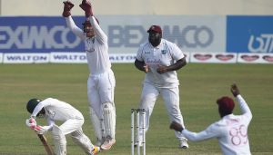 West Indies' wicketkeeper Joshua Da Silva (2L) with teammates Rahkeem Cornwall (2R) and Nkrumah Bonner successfully appeals for the dismissal of Bangladesh's Mushfiqur Rahim (L) during the fourth day of the second Test cricket match between West Indies and Bangladesh at the Sher-e-Bangla National Cricket Stadium in Dhaka in February 14, 2021. (Photo by Munir Uz zaman / AFP) (Photo by MUNIR UZ ZAMAN/AFP via Getty Images)