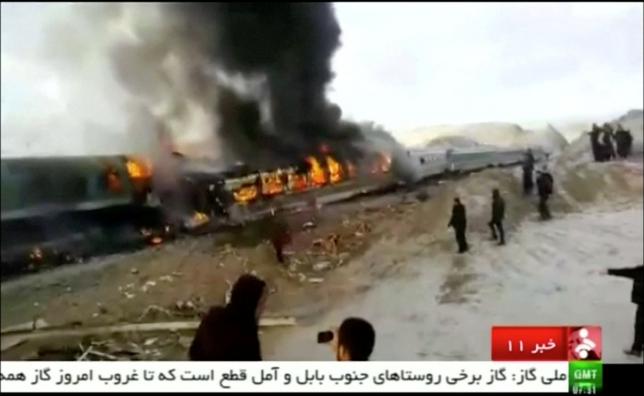 People gather around two passenger trains that collided in the city of Shahroud, in the north-central province of Semnan, killing several people, in this still frame taken from video, November 25, 2016. IRINN/ via REUTERS TV