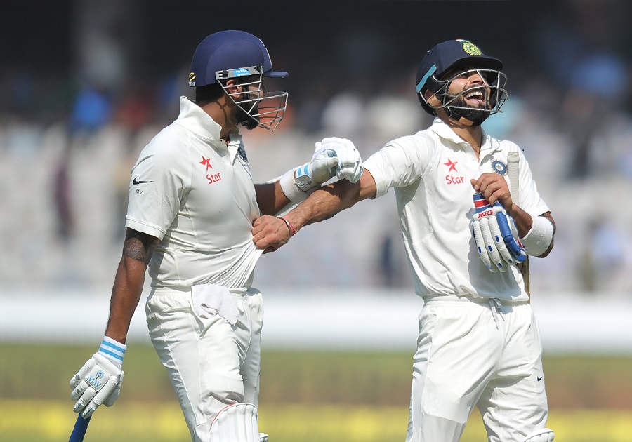 India's captain Virat Kohli (R) shares a light moment with teammate Murali Vijay as they walk back to the pavilion at the tea interval during the first day of the Test cricket match between India and Bangladesh at The Rajiv Gandhi International Cricket Stadium in Hyderabad on February 9, 2017. ---------IMAGE RESTRICTED TO EDITORIAL USE - STRICTLY NO COMMERCIAL USE----- / GETTYOUT / AFP PHOTO / NOAH SEELAM / ----IMAGE RESTRICTED TO EDITORIAL USE - STRICTLY NO COMMERCIAL USE----- / GETTYOUT