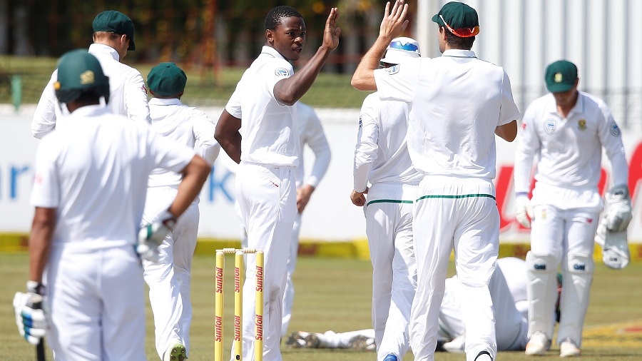 South African bowler Kagiso Rabada (L) celebrates the dismissal of Bangladesh batsman Mushfiqur Rahim (not in picture) during the fifth day of the Test Match between South Africa and Bangladesh on October 2, 2017 in Potchefstroom.   / AFP PHOTO / GIANLUIGI GUERCIA        (Photo credit should read GIANLUIGI GUERCIA/AFP/Getty Images)