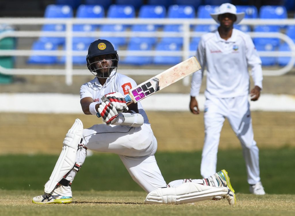 Kusal Mendis (L) of Sri Lanka hits 4 during day 4 of the 1st Test between West Indies and Sri Lanka at Queen's Park Oval, Port of Spain, Trinidad, on June 9, 2018.18. (Photo by Randy Brooks / AFP)        (Photo credit should read RANDY BROOKS/AFP/Getty Images)