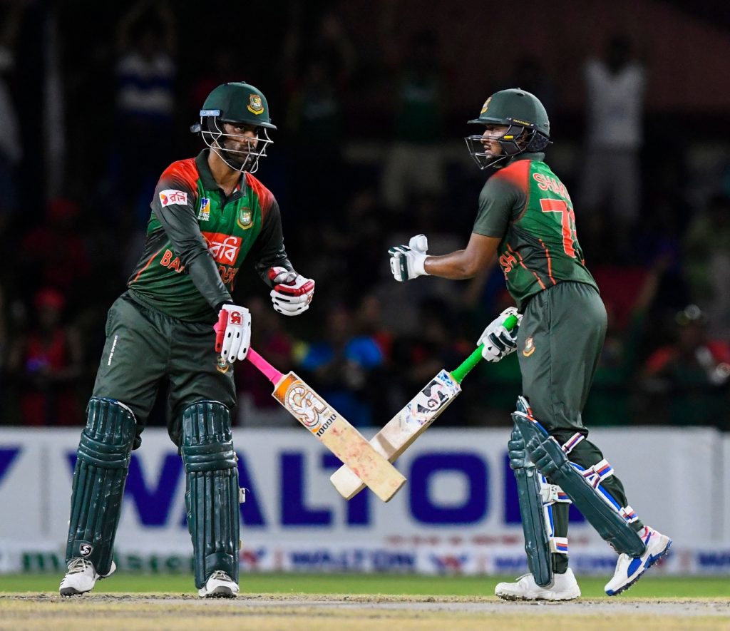 Tamim Iqbal (L) and Shakib Al Hasan (R) of Bangladesh speak during the 2nd T20i match between West Indies and Bangladesh at Central Broward Regional Park Stadium in Fort Lauderdale, Florida, on August 4, 2018. (Photo by Randy Brooks / AFP) (Photo credit should read RANDY BROOKS/AFP/Getty Images)