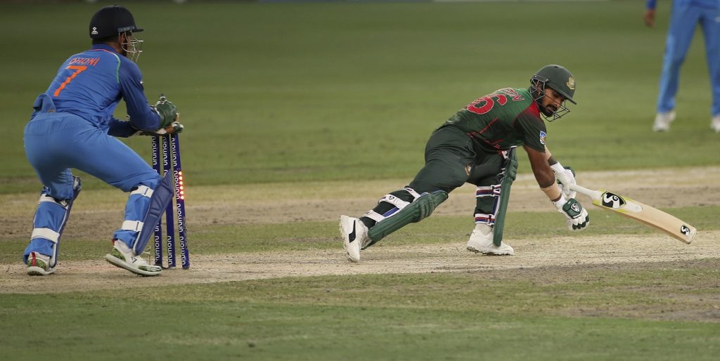 India's wicketkeeper Mahendra Singh Dhoni, left, stumps out Bangladesh's Liton Das, right, during the final one day international cricket match of Asia Cup between India and Bangladesh, in Dubai, United Arab Emirates, Friday, Sept. 28, 2018. (AP Photo/Aijaz Rahi)