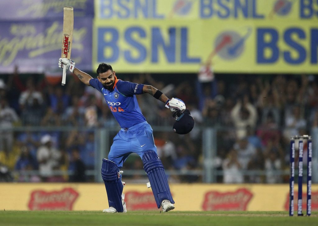 India's captain Virat Kohli celebrates after scoring a century during the first one-day international cricket match between India and West Indies in Gauhati, India, Sunday, Oct. 21, 2018. (AP Photo/Anupam Nath)