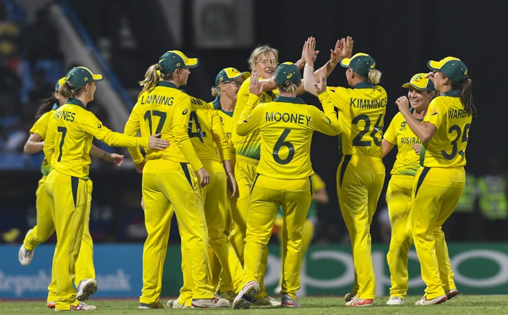 Ellyse Perry (C) and her Australia teammates celebrate the dismissal of Deandra Dottin of West Indies during the ICC Women's World T20 1st semi-final match between Australia and West Indies at Sir Vivian Richards Cricket Ground, North Sound, Antigua and Barbuda, on November 22, 2018. (Photo by Randy Brooks / AFP)        (Photo credit should read RANDY BROOKS/AFP/Getty Images)