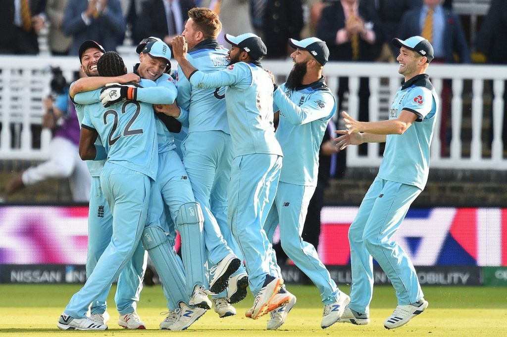 England's Jos Buttler (3rd L) celebrates with teammates after they win the super over to win the 2019 Cricket World Cup final between England and New Zealand at Lord's Cricket Ground in London on July 14, 2019. - England won the World Cup for the first time as they beat New Zealand in a Super Over after a nerve-shredding final ended in a tie at Lord's on Sunday. (Photo by Glyn KIRK / AFP) / RESTRICTED TO EDITORIAL USE        (Photo credit should read GLYN KIRK/AFP/Getty Images)