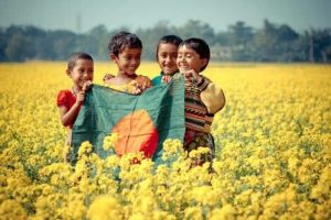 bangladeshi child's happiness with flag